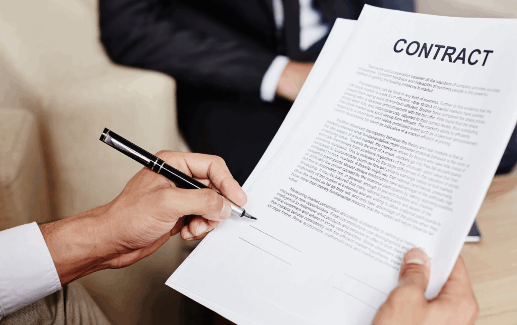 Hands holding a written contract