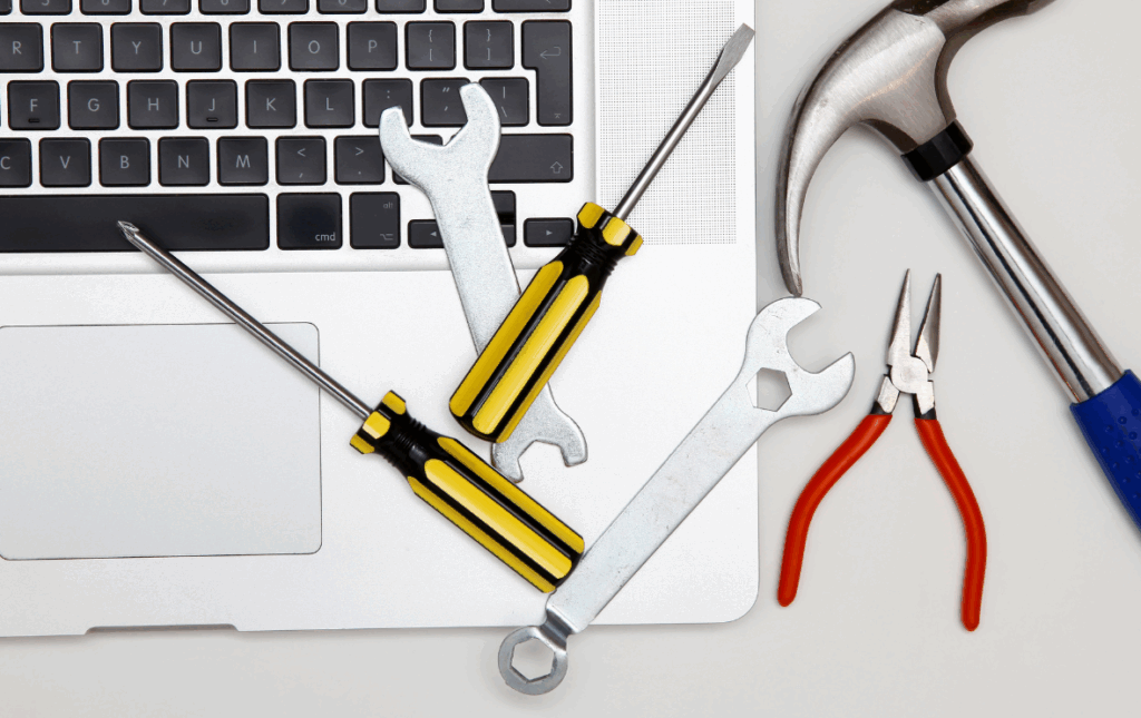Tools scattered across laptop